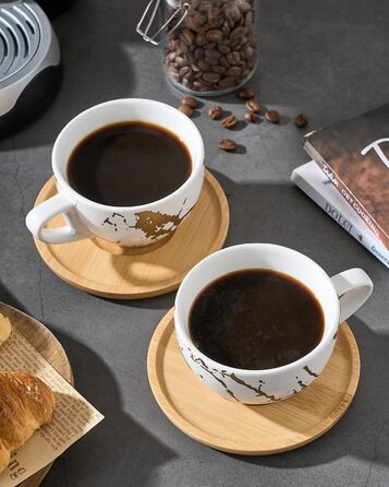 Набір керамічних чашок капучино HOME DECOR 4 шт., 220 мл, з металевим підставкою. Підходить для капучино, лате, американо та чаю. Чорний та білий дизайн.