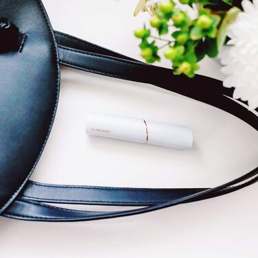 Електричний жіночий тример для обличчя та тіла Finishing Touch Flawless - рожеве золото, з 2 змінними насадками