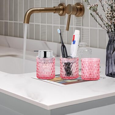 Pink bathroom accessory set made of glass, including a toothbrush holder, soap dispenser, and cup, a foaming soap dispenser, and a toothbrush holder, 3 pink bathroom cups for brush, toothpaste.