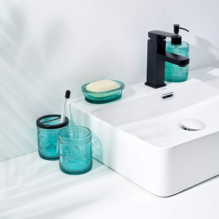 4-piece glass bathroom accessory set with decorative pressed pattern, including soap dispenser, tumbler, soap dish, and toothbrush holder, blue-green