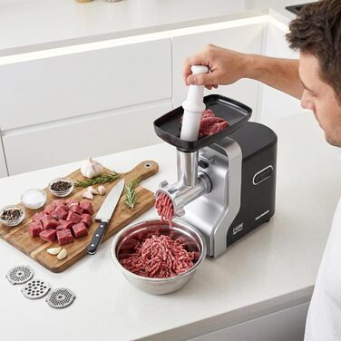 М'ясорубка електрична MG-2100BKSL 2100 Вт, нержавіюча сталь, чорно-срібна - 1.8 кг/хв, насадки для ковбас та томатів, реверс